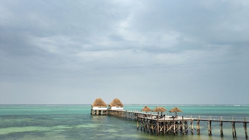 Pier over sea against sky