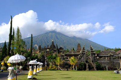 Panoramic view of buildings and mountains against sky