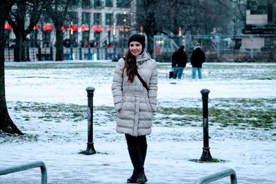 Portrait of young woman in snow