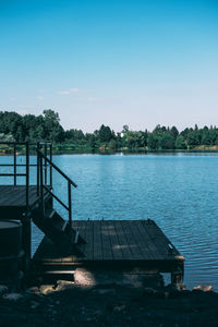 Pier over lake against sky
