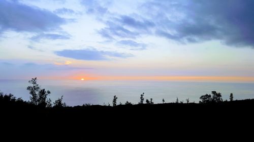 Scenic view of silhouette landscape against sky during sunset