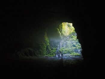 Group of people entering scenic cave