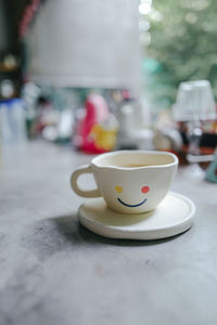 Close-up of coffee cup on table