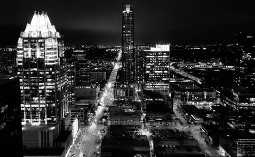 Illuminated buildings in city at night