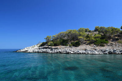 Scenic view of sea against clear blue sky