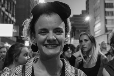 Close-up portrait of smiling young woman