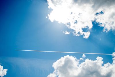 Low angle view of vapor trails in sky