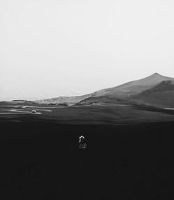 Rear view of a person standing in desert