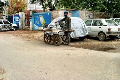 Man riding motorcycle on road