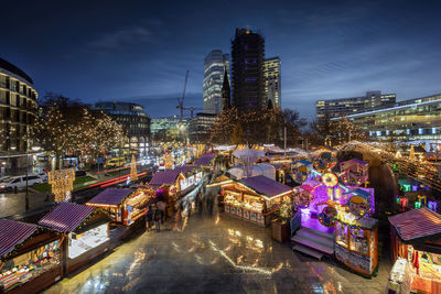 Illuminated buildings in city at night