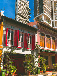 Low angle view of building by street in city