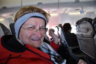 Portrait of woman sitting in airplane