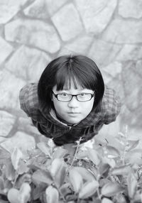 Portrait of teenage girl wearing eyeglasses while standing on street