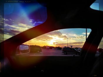 Car on road at sunset