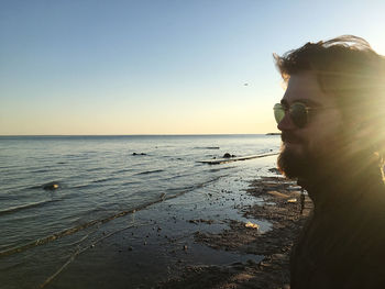 Scenic view of sea against clear sky during sunset