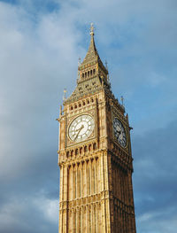 Low angle view of clock tower against sky