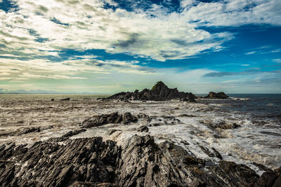 Panoramic view of arid landscape against sky