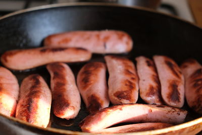 Close-up of meat in cooking pan