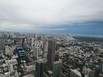 High angle view of city buildings against sky