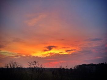 Silhouette landscape against scenic sky