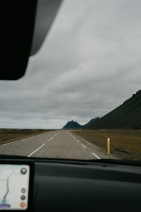 Close-up of car against sky