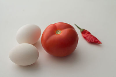 Close-up of fruits over white background