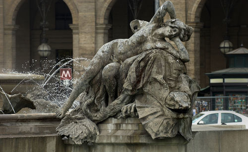 Statue against historic building