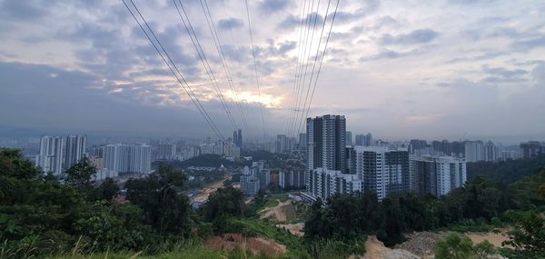 Panoramic view of city buildings against sky
