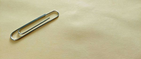 High angle view of paper clip on table