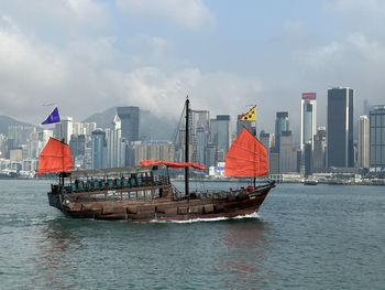 Boats in sea against sky