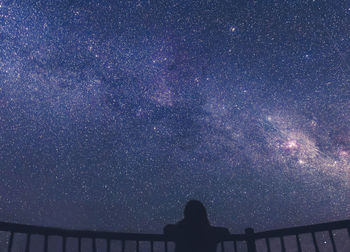 Low angle view of silhouette stars against sky at night