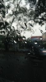 Full frame shot of wet glass window in rainy season