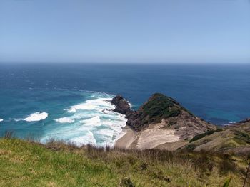 The tasmanian ocean meets the pacific at cape reinga.