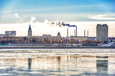 View of river with buildings in background