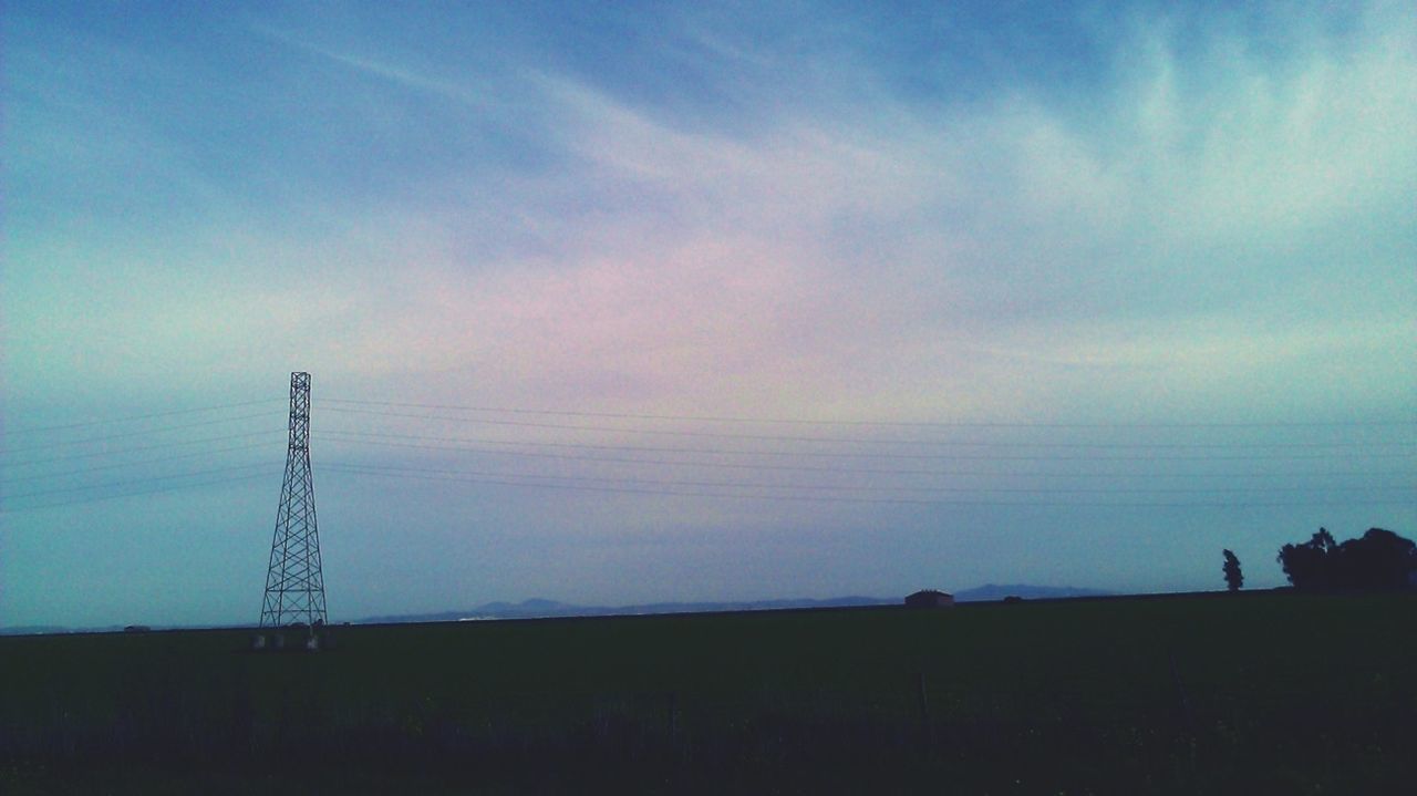 silhouette, electricity pylon, sky, electricity, power line, fuel and power generation, connection, tranquility, low angle view, power supply, technology, tranquil scene, blue, scenics, nature, beauty in nature, cloud - sky, sunset, dusk, outdoors