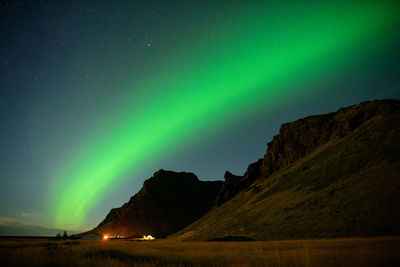 Scenic view of landscape against sky at night