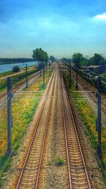 Railroad track with trees in background