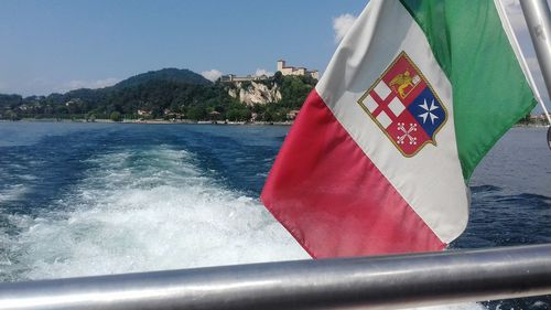 Close-up of flag on boat against sea