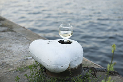 Wineglass in cleat by river