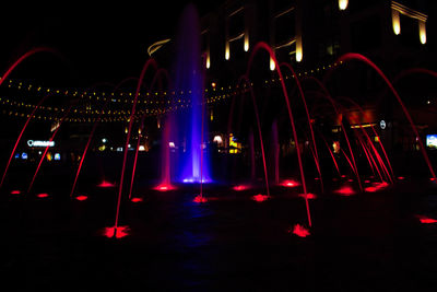 Illuminated lights in city at night