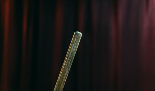 Close-up of metallic object on wood