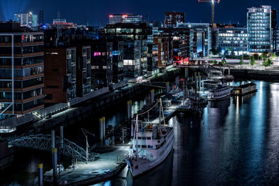 Aerial view of illuminated city at night