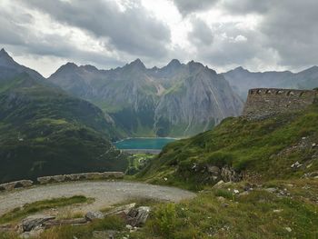 Scenic view of lake and mountains against sky