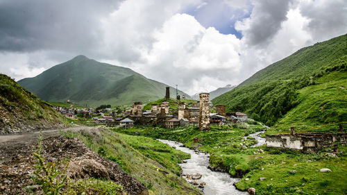 Panoramic shot of building and mountains against sky