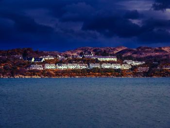 Scenic view of sea against sky at night