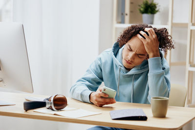 Young woman working at office