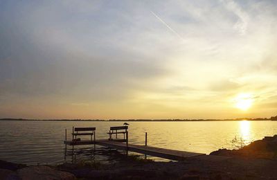 Scenic view of calm sea at sunset