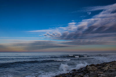 Scenic view of sea against sky during sunset