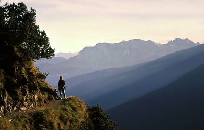Rear view of woman looking at mountain landscape