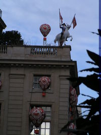 Low angle view of statue against building